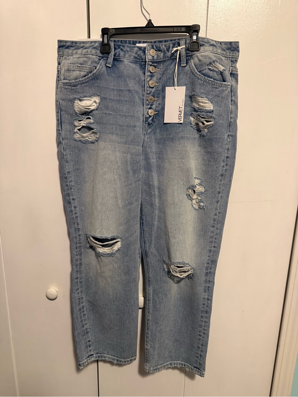 Women’s Light Wash Distressed Boyfriend Jeans with Button-Fly